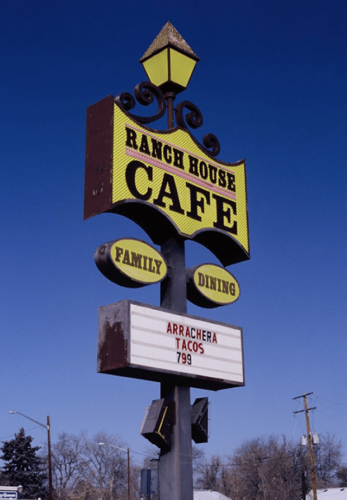 Sign for Ranch House Cafe featuring "Family Dining" and a menu item: "Arrachera Tacos" priced at $7.99.