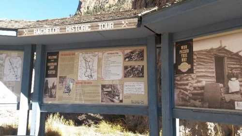 Signage for the Bachelor Historic Tour, featuring maps and historical photos of the area.