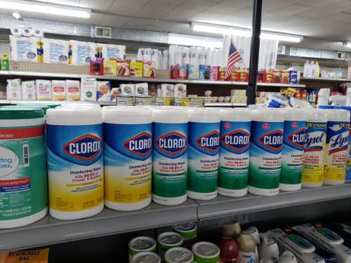 A shelf displaying various Clorox disinfecting wipes and cleaning products in a store aisle.