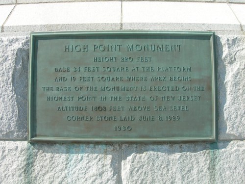 Plaque detailing the High Point Monument's height, base dimensions, and location in New Jersey, established in 1930.
