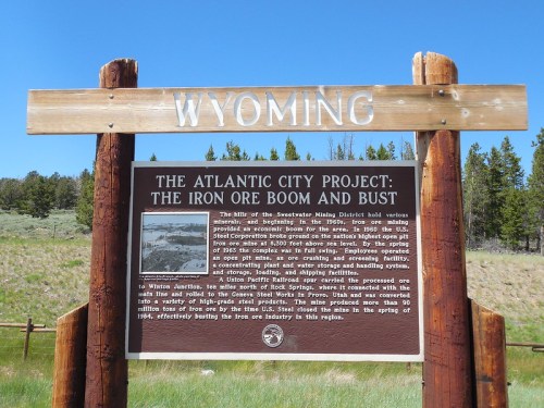 Sign about the Atlantic City Project in Wyoming, detailing the iron ore boom and bust in the region's mining history.