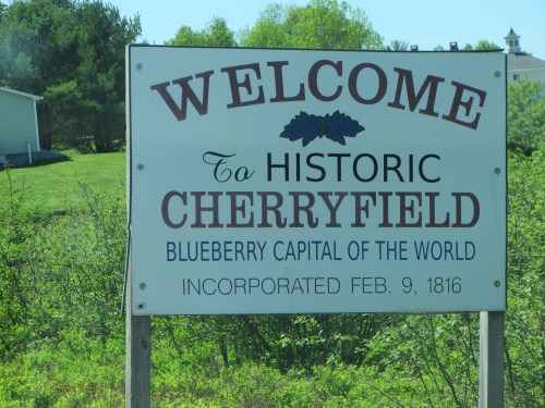 Sign welcoming visitors to Historic Cherryfield, the Blueberry Capital of the World, established in 1816.