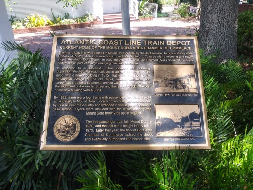 Plaque detailing the history of the Atlantic Coast Line Train Depot in Mount Dora, Florida, established in 1915.