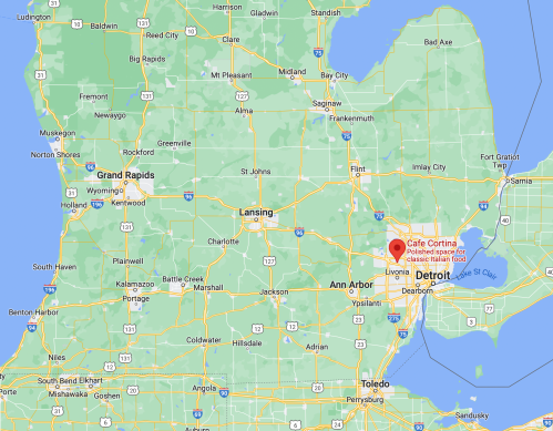 Map of Michigan highlighting Detroit and nearby cities, with a marker for Cafe Cortina.