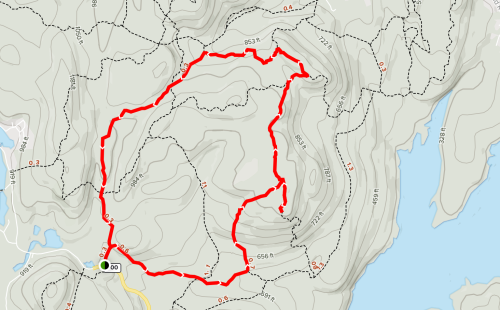 A topographic map showing a red trail route winding through hilly terrain, with elevation markers and nearby water.