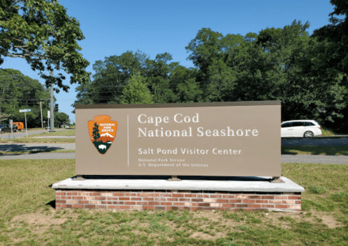 Sign for Cape Cod National Seashore at Salt Pond Visitor Center, featuring the National Park Service logo.