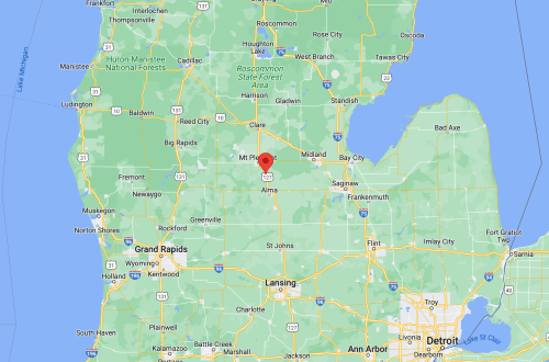 Map of Michigan highlighting a location near Alma, with surrounding cities and landmarks visible.
