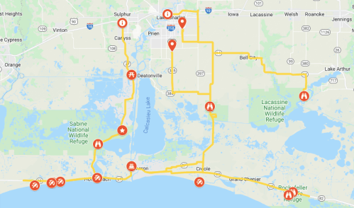 Map showing routes and points of interest around Lake Charles, Louisiana, including wildlife refuges and parks.