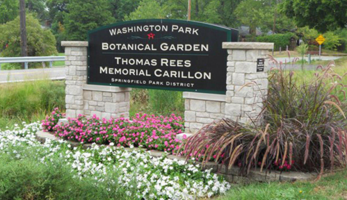 Sign for Washington Park Botanical Garden, featuring flowers and greenery, located in Springfield Park District.