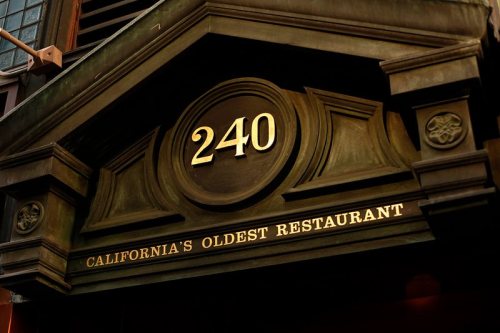 Sign above a restaurant entrance reads "240" and "California's Oldest Restaurant."