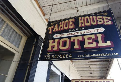 Sign for Tahoe House Hotel, established in 1859, highlighting history, romance, and comfort. Phone: 775-847-5264.