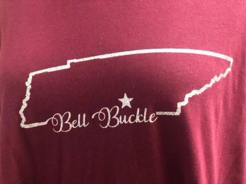 Maroon shirt featuring a glittery outline of Tennessee with "Bell Buckle" and a star inside the state shape.