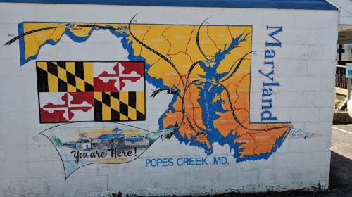 Mural of Maryland map highlighting Pope's Creek, featuring the state flag and "You are Here!" text.