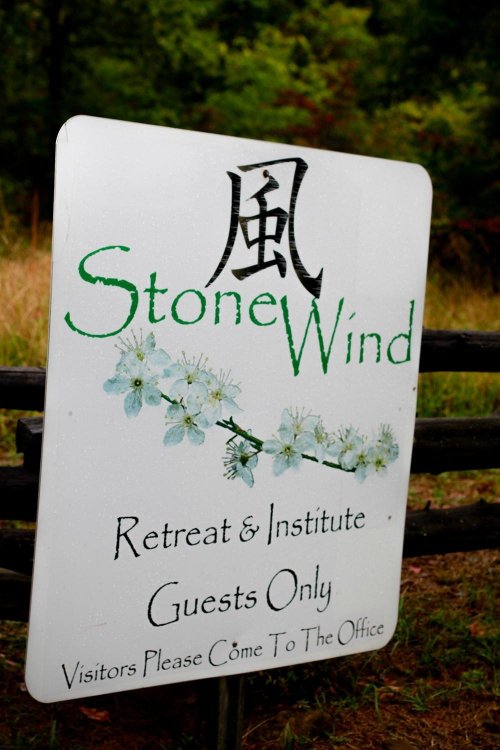 Sign for StoneWind Retreat & Institute, stating "Guests Only" and directing visitors to the office.