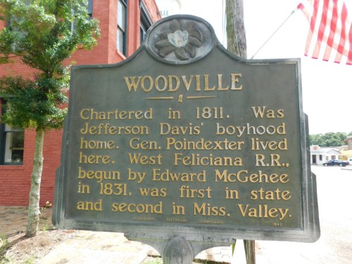 Historical marker for Woodville, noting its founding in 1811 and connections to Jefferson Davis and Edward McGehee.