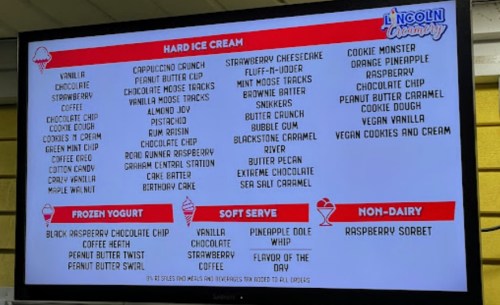 Menu board displaying various ice cream flavors, frozen yogurt, soft serve, and non-dairy options at Lincoln Creamery.
