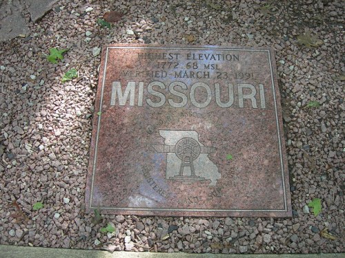 A granite plaque marking the highest elevation in Missouri, 1,772 feet, established on March 23, 1991.