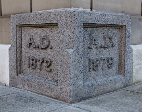 Stone corner of a building with engraved dates: "A.D. 1872" and "A.D. 1878."