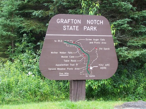 Sign for Grafton Notch State Park, showing trails, picnic areas, and nearby attractions like Mother Walker Falls and Moose Cave.