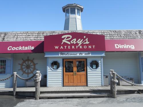 Exterior of Ray's Waterfront restaurant, featuring a welcoming entrance and nautical decor.