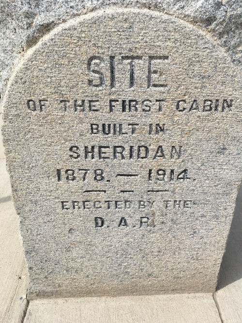 Stone marker commemorating the site of the first cabin built in Sheridan, 1878-1914, erected by the D.A.R.