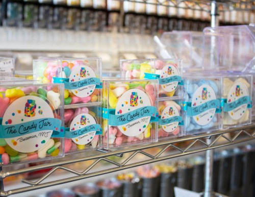 Colorful candy jars filled with assorted sweets, displayed on a shelf at The Candy Jar in Bozeman, MT.