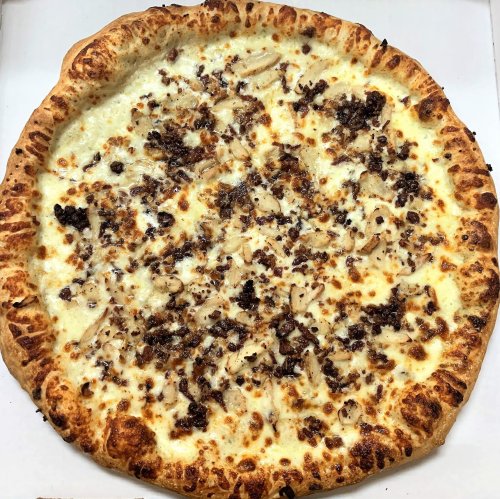 A freshly baked pizza with a golden crust, topped with melted cheese and ground meat.