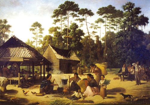 A historical scene depicting a group of people engaged in daily activities near rustic homes in a forested area.