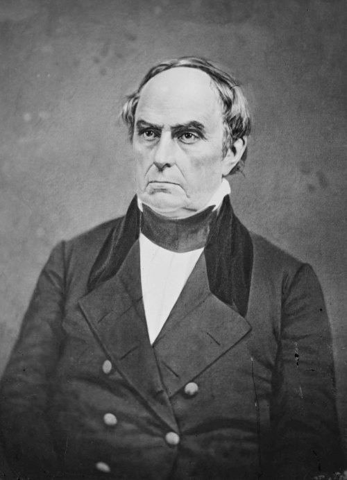 A historical portrait of a middle-aged man in formal attire, with a serious expression and styled hair.