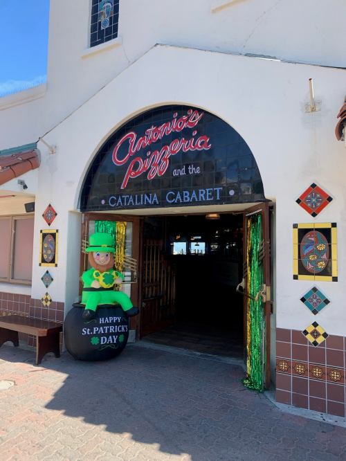Entrance to Antonio's Pizzeria and Catalina Cabaret, decorated for St. Patrick's Day with a leprechaun figure.