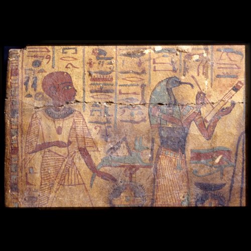 Ancient Egyptian mural depicting two figures, one holding a tool, surrounded by hieroglyphs and symbols.