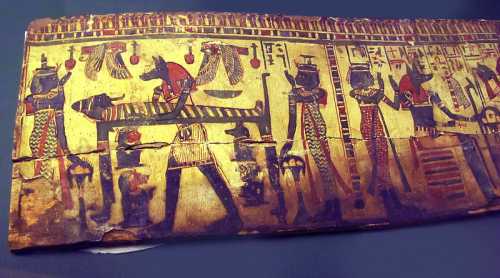 Ancient Egyptian artwork depicting gods, a sarcophagus, and ritual scenes with vibrant colors and hieroglyphs.