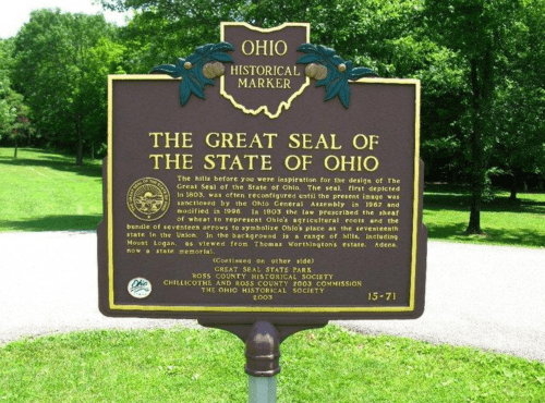 Historical marker for the Great Seal of Ohio, detailing its history and significance. Green landscape in the background.