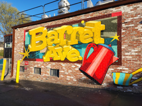 Colorful mural on a brick wall featuring the text "Barret Ave" and a red kettle illustration.