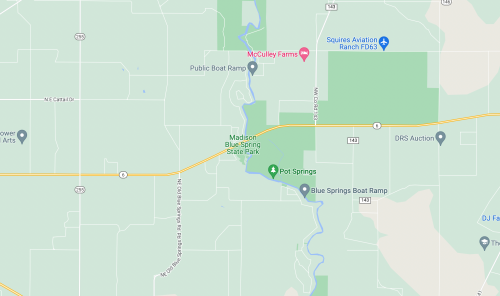 Map showing Madison Blue Spring State Park, nearby roads, and public boat ramps in a rural area.