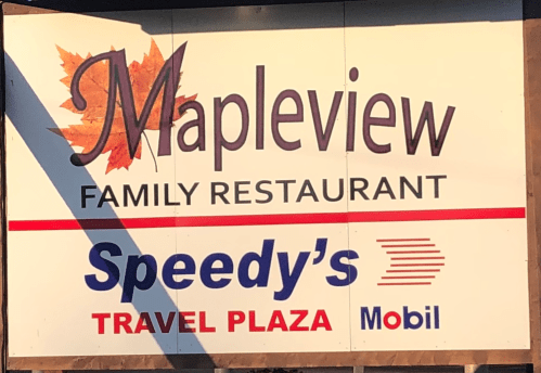 Sign for Mapleview Family Restaurant and Speedy's Travel Plaza, featuring a maple leaf design.