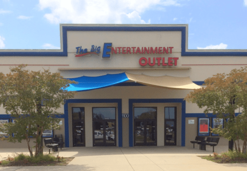 Exterior of The Big Entertainment Outlet, featuring a colorful awning and large entrance doors.