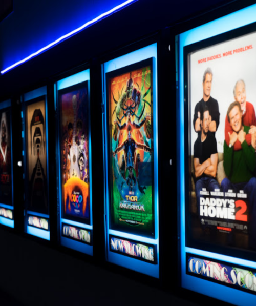 Movie theater display featuring posters for various films, including "Thor: Love and Thunder" and "Daddy's Home 2."