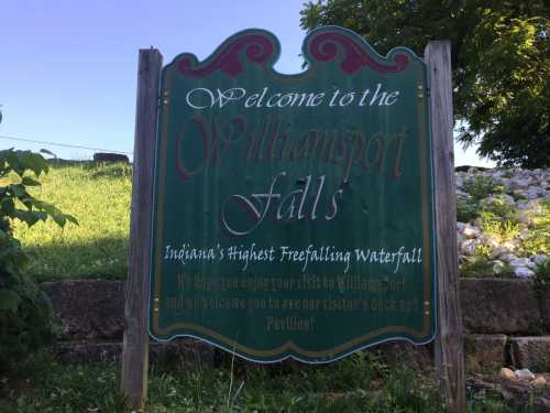 Sign welcoming visitors to Williamsport Falls, Indiana's highest free-falling waterfall, with information for guests.