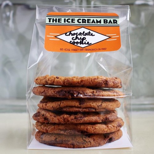 A clear bag containing a stack of chocolate chip cookies, labeled "The Ice Cream Bar."