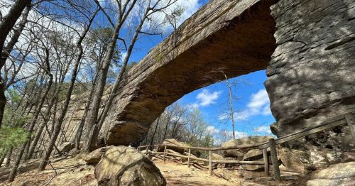 Sandstone rock formation in Kentucky resembling a natural arch.