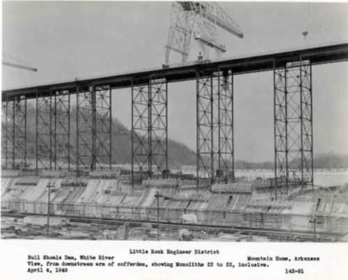 Black and white photo of Bull Shoals Dam construction, showing large structures and cranes, dated April 4, 1949.