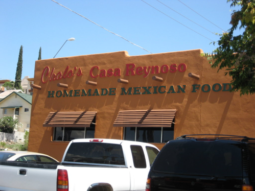 Sign for "Chalo's Casa Reynoso" featuring "Homemade Mexican Food" on a warm-colored building.