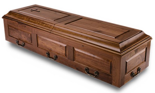 A wooden coffin with a polished finish and decorative handles, viewed from the side.