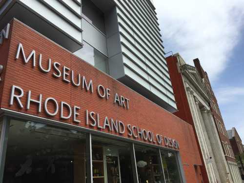 Exterior view of the Museum of Art at the Rhode Island School of Design, featuring modern architecture and signage.