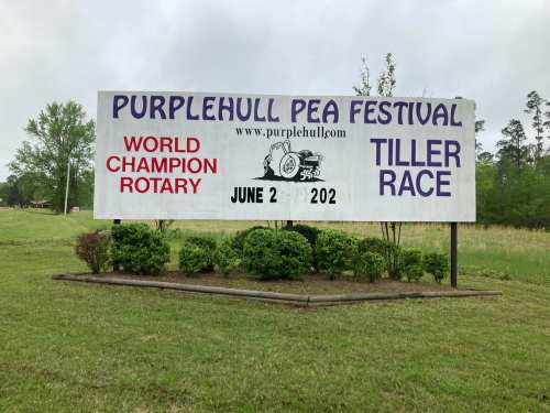 Sign for the Purple Hull Pea Festival featuring a World Champion Rotary Tiller Race on June 2.