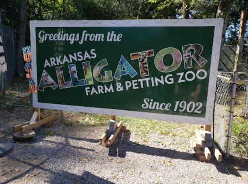 Sign for Arkansas Alligator Farm & Petting Zoo, featuring colorful letters and the text "Since 1902."