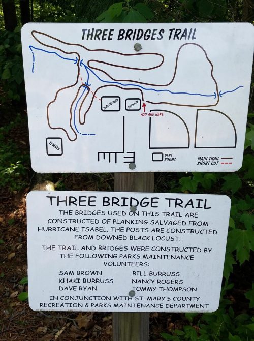 Trail map and information sign for the Three Bridges Trail, detailing routes and volunteer contributions.