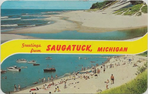 A vintage postcard featuring a beach scene in Saugatuck, Michigan, with boats and people enjoying the sun.