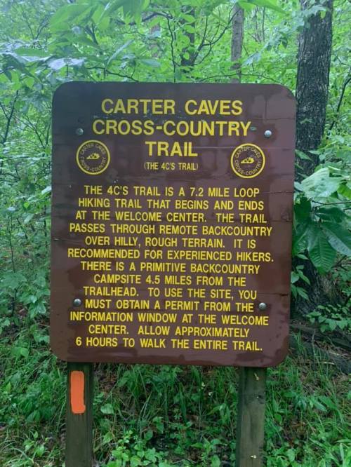 Sign for Carter Caves Cross-Country Trail, detailing the 7.2-mile loop trail and backcountry camping information.